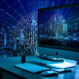 金衡资讯行情数据编辑高维安在办公桌前核对金价报价表格的工作场景